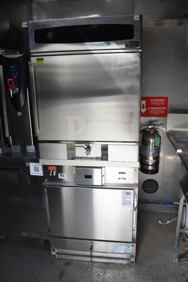 Interior of 2021 Texino 28ft food trailer with Winston CVap holding cabinet, fire extinguisher, and stainless steel surfaces.