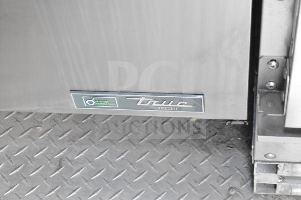2021 Texino food trailer's True freezer label, highlighting natural refrigerant usage, against diamond plate flooring.