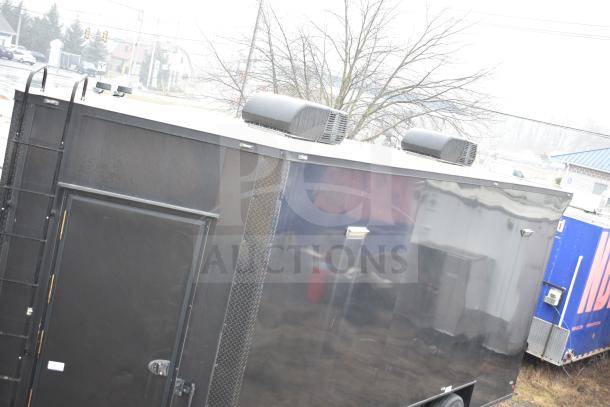 2020 Southern Dimensions Group 8.5' x 20' all-black mobile commissary trailer, tandem axle, features rooftop AC units.