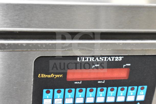 Close-up of Ultrastat23 fryer control panel on 2021 Texino commercial food trailer. Visible buttons and heat settings.
