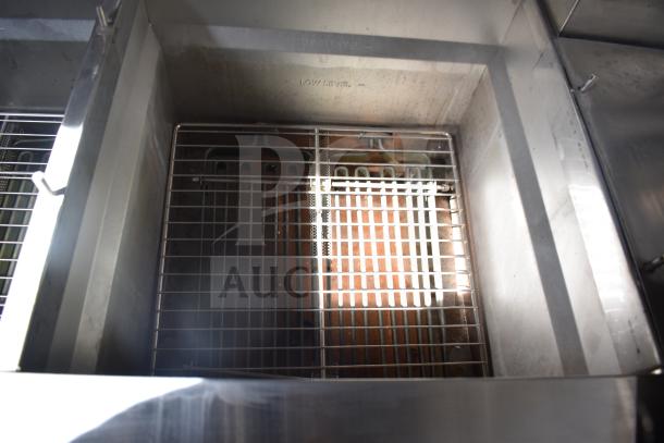 Interior of Ultrafryer 4-Bay Fryer in new Texino 28ft food trailer, showing clean metal frying chamber and wire racks.