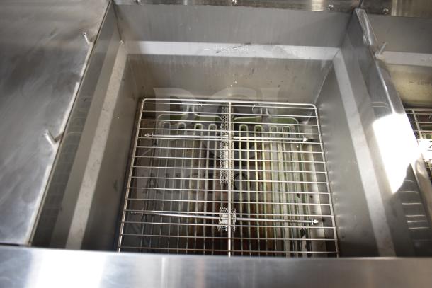 Stainless steel interior of 2021 Texino food trailer with Ultrafryer 4-bay fryer, clean condition, visible heat coils.
