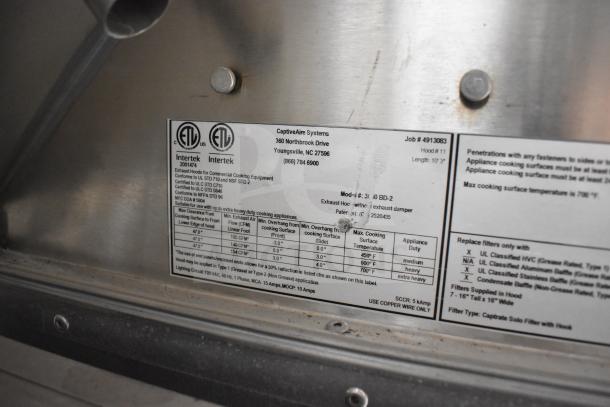 CaptiveAire exhaust hood label inside 2021 Texino food trailer. Certification details, flow specs, and usage instructions visible.