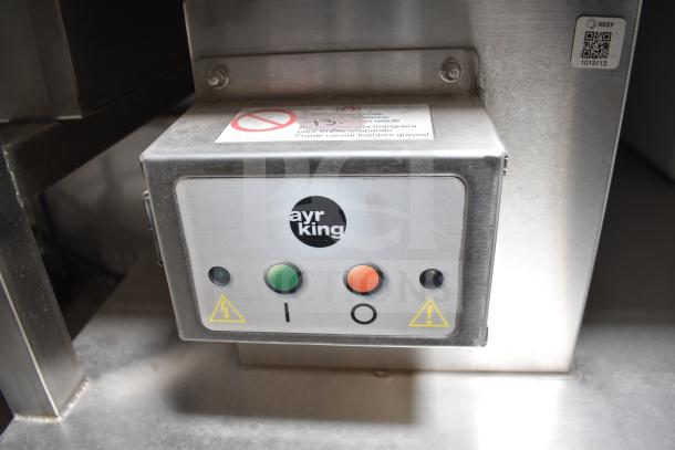 Control panel for an Ayr King device in the Texino food trailer, features power and caution indicators.