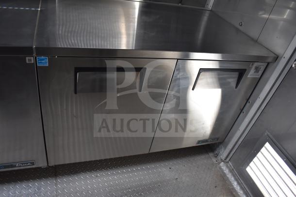 Texino 28ft food trailer featuring True refrigeration unit, stainless steel, dual-door, pristine condition, 2021 model.