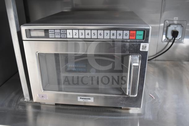 Panasonic NE-17523 commercial microwave in stainless steel, featuring numeric keypad and start/stop buttons.