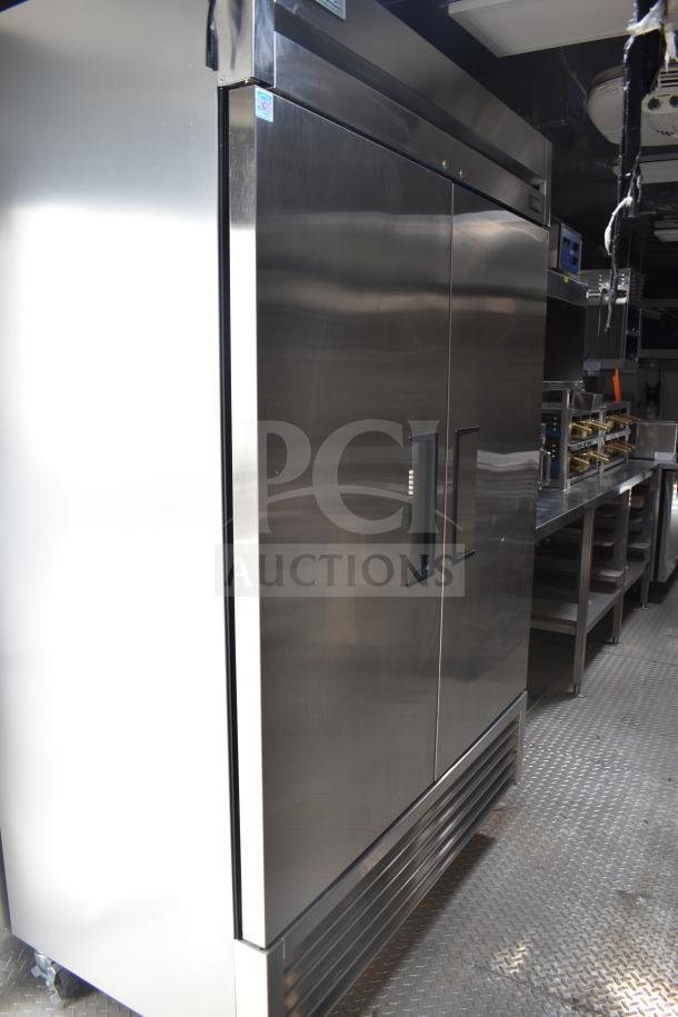 Texino 28ft food trailer interior shows a full True refrigeration suite with stainless steel finish, in excellent condition.