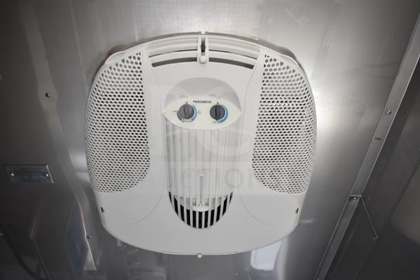 Ceiling-mounted Dometic unit in the Texino 2021 food trailer, featuring fan and temperature controls.