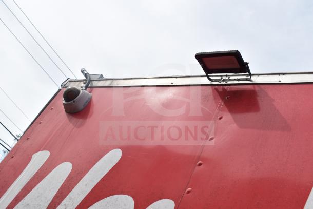 2021 Rock Solid Cargo 28ft food trailer, showing exterior with security camera and light fixture. VIN: 7H2BE283XND041759.