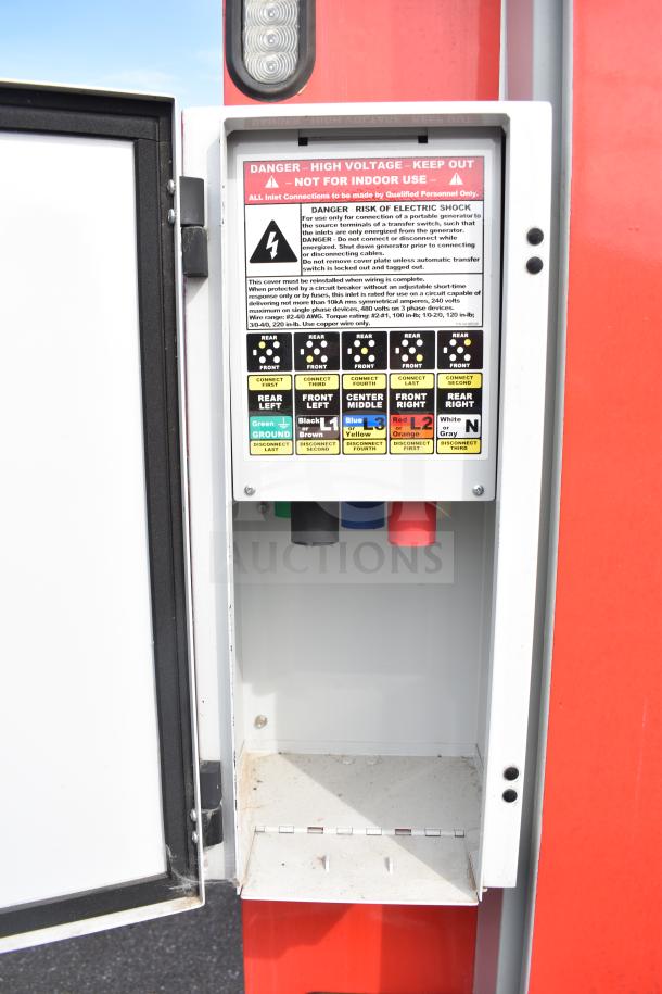 Electrical panel on a 2021 Rock Solid Cargo 28ft food trailer, showing warning labels and wiring connections. High voltage caution.