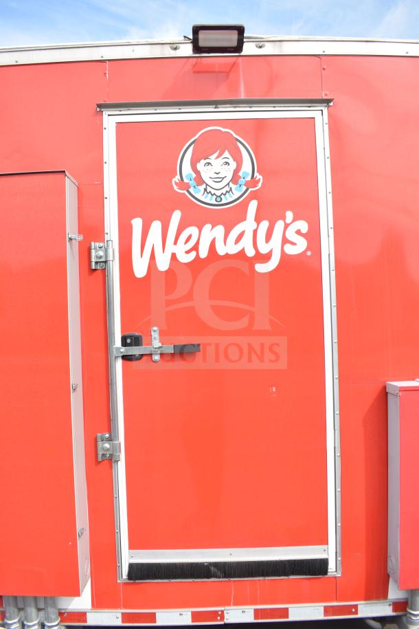 2021 Rock Solid Cargo 28ft food trailer, red exterior with Wendy's branding. Includes Henny Penny fryer, Taylor griddle, CaptiveAire hood.