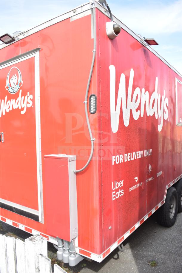 2021 Rock Solid Cargo 28ft food trailer, branded red with Wendy's graphics for delivery. Triple-axle, commercial kitchen.