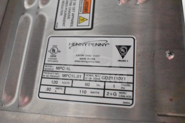 Henny Penny electric fryer label showing model MPC-1L, product number MPC1L.01, and serial number GD2111071.