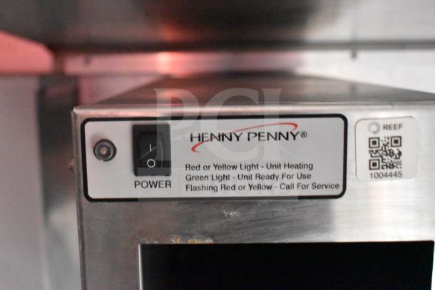 Henny Penny electric fryer control panel with power switch, status lights, and label instructions.