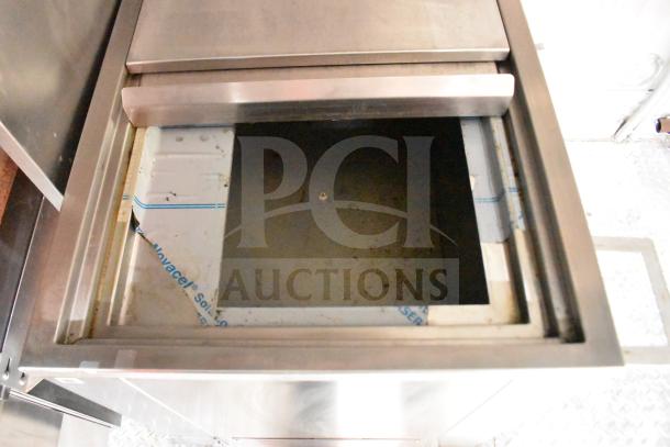 2021 Rock Solid Cargo 28ft trailer interior, showing stainless steel cooking equipment. Good condition, visible wear.
