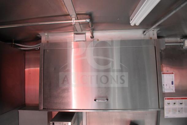 2021 Rock Solid Cargo food trailer interior, featuring stainless steel CaptiveAire hood. Clean, well-maintained condition.