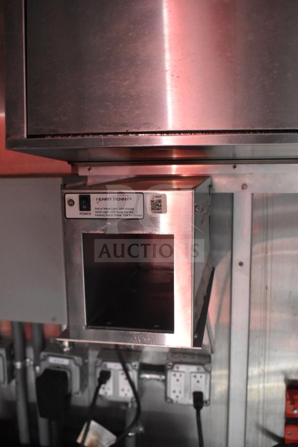 Henny Penny electric fryer in a 2021 Rock Solid Cargo 28ft food trailer, stainless steel finish, power switch visible.