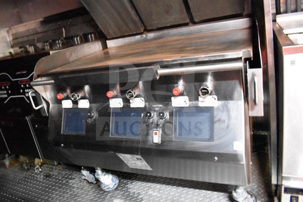 2021 Rock Solid Cargo 28ft food trailer interior featuring a Taylor clamshell griddle with control panels, pristine condition.