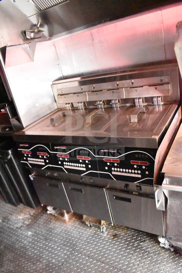 2021 Rock Solid Cargo 28ft food trailer kitchen with Henny Penny electric fryer, Taylor clamshell griddle, CaptiveAire hood.