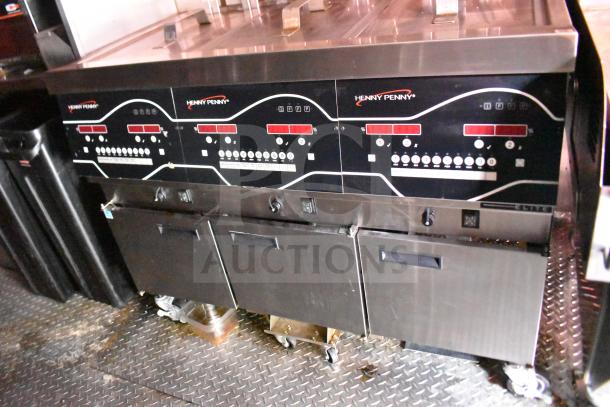 Henny Penny electric fryer in a 2021 Rock Solid Cargo food trailer; features control panel and lower compartments.