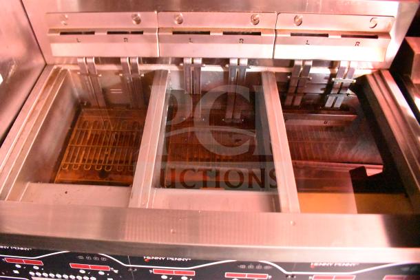 Henny Penny electric fryer inside a 2021 Rock Solid Cargo 28ft triple-axle food trailer, featuring multiple oil vats.