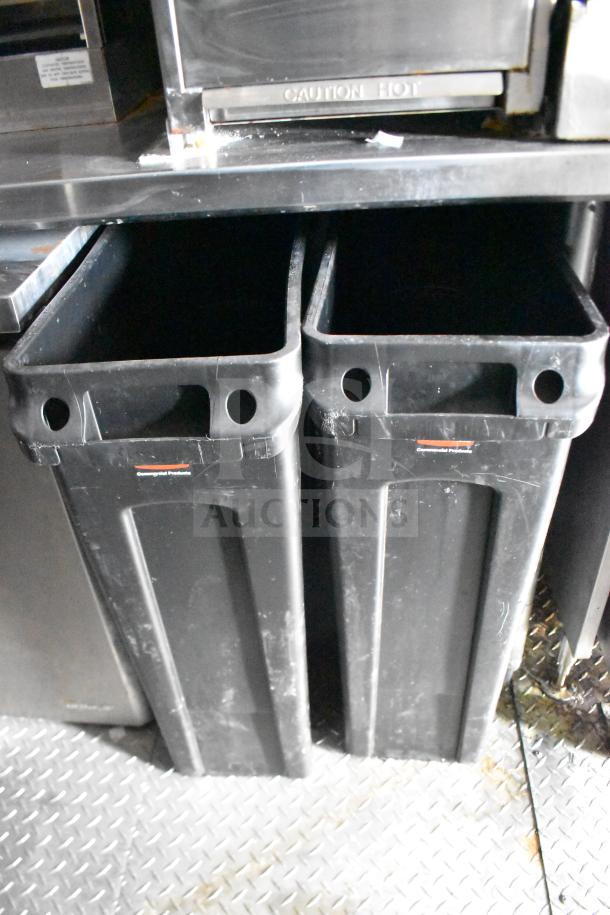 Alt text: Black containers inside the 2021 Rock Solid Cargo food trailer, showcasing kitchen storage.