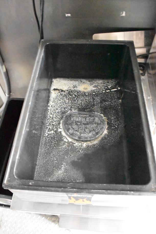 Close-up of the Henny Penny electric fryer inside the 2021 Rock Solid Cargo food trailer, showing use marks.