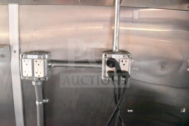 Electrical outlets inside a 2021 Rock Solid Cargo 28ft food trailer, featuring rugged power connections.