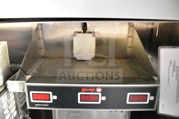 Henny Penny Electric Fryer in 2021 Rock Solid Cargo 28ft food trailer. Features digital control panel, branded with Wendy's logo.