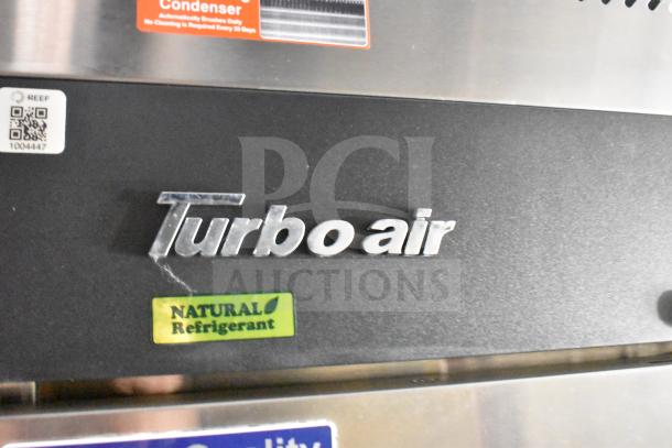 Turbo Air logo on a commercial refrigerator featuring "Natural Refrigerant" and "Self-Cleaning Condenser" labels.
