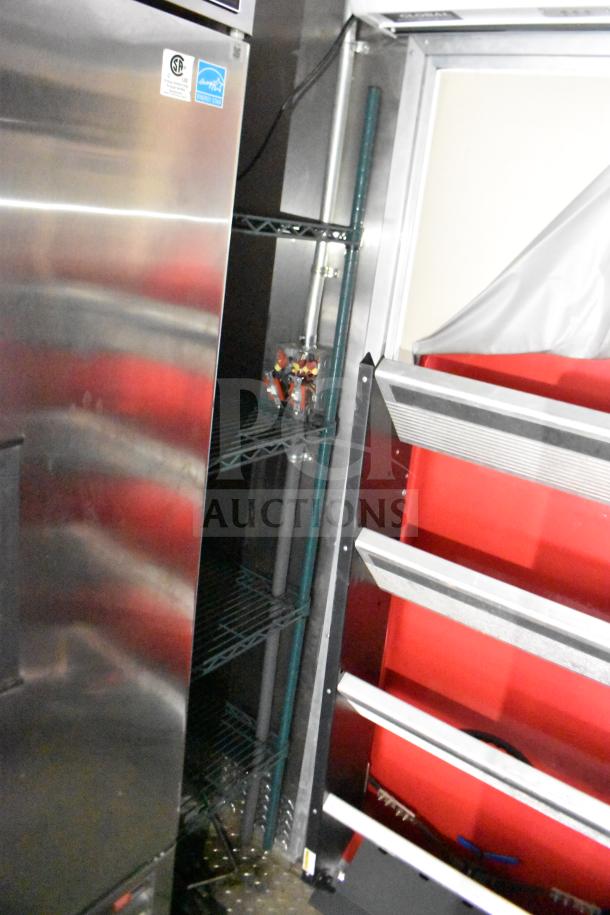2021 Rock Solid Cargo 28ft food trailer interior; visible fridge, shelving, and part of hood system.