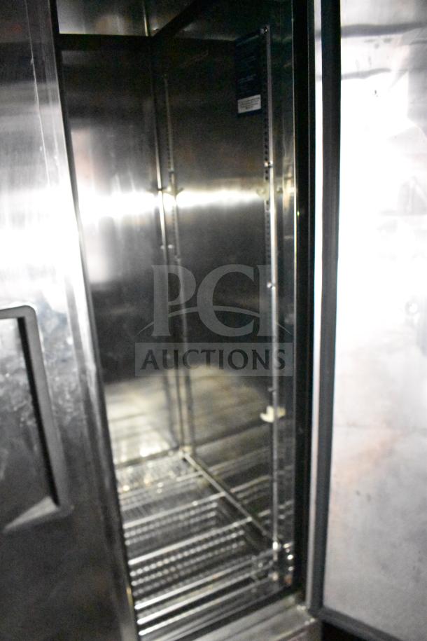 Interior of a 2021 Rock Solid Cargo 28ft food trailer, showing stainless steel shelving, part of full refrigeration package.