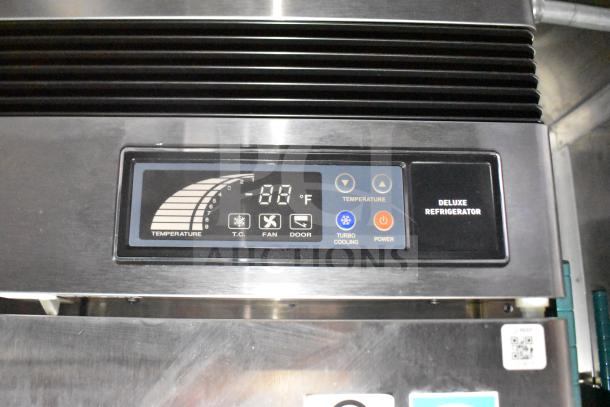 Close-up of the deluxe refrigerator control panel in a 2021 Rock Solid Cargo 28ft food trailer, showing temperature settings.