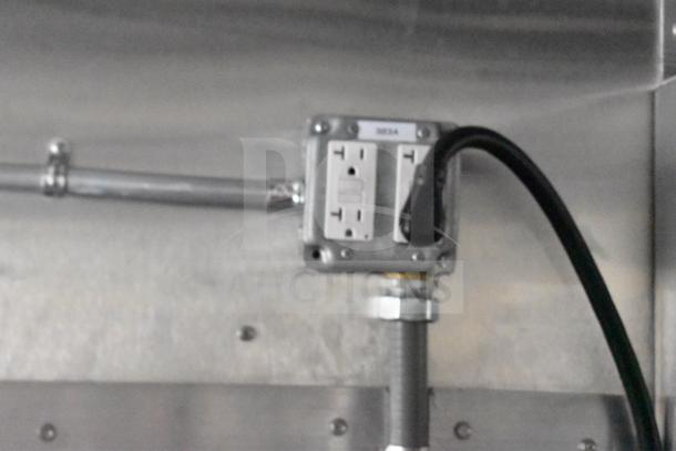 Power outlet inside a 2021 Rock Solid Cargo 28ft food trailer, equipped with commercial kitchen appliances.