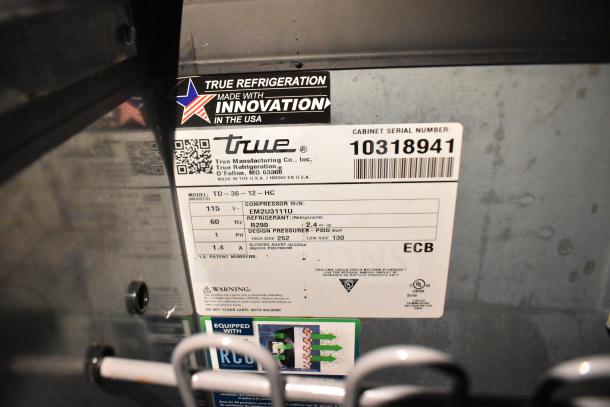 True Refrigeration label on commercial food trailer, model TD-36-12-HC, serial 10318941, features and specifications visible.