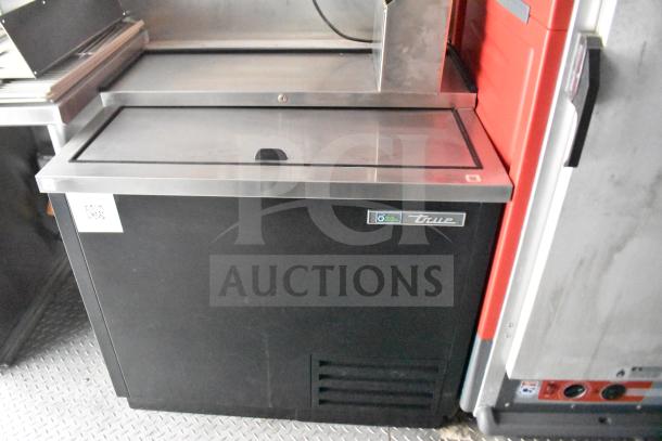 2021 Rock Solid Cargo 28ft food trailer interior. Features True refrigeration. Mounted on commercial-grade floor.