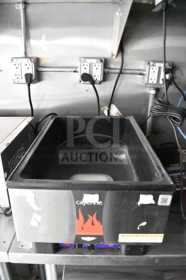 Interior of 2021 Rock Solid Cargo food trailer showing electric fryer with visible power outlets and wiring.