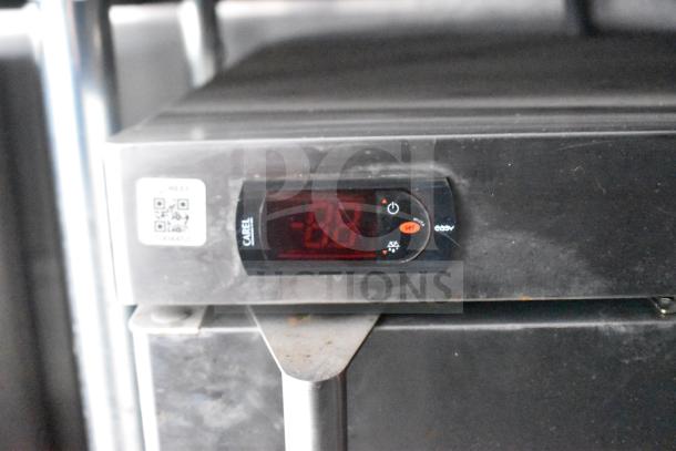 Digital display of a Carel refrigeration unit in a 2021 Rock Solid Cargo food trailer, showing temperature controls.