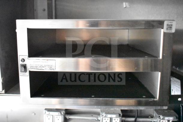 Stainless steel Henny Penny electric fryer in a 2021 Rock Solid Cargo food trailer, with power switch and status lights.