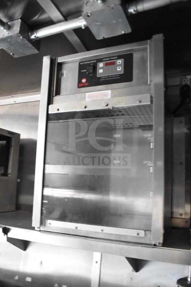 Henny Penny electric fryer in Rock Solid Cargo 28ft food trailer, displaying control panel and stainless steel build.