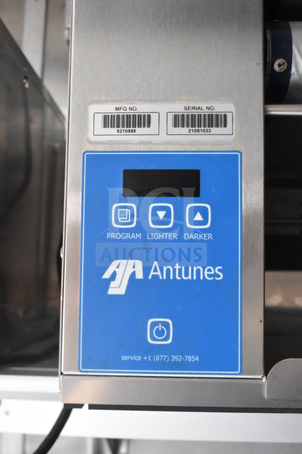Antunes control panel with program, lighter, darker buttons and contact info. Labels show MFG No: 9210888, Serial No: 21081033.