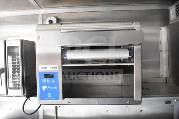Antunes toaster in stainless steel cabinet, programmable controls, displaying model details.