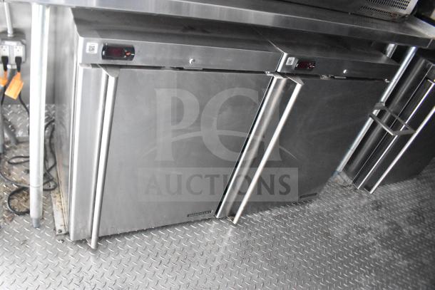 2021 Rock Solid Cargo 28ft food trailer interior showing stainless steel refrigeration units; excellent condition.