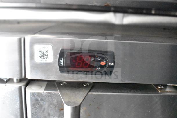 Control panel of a refrigeration unit inside a 2021 Rock Solid Cargo 28ft food trailer, featuring a Carel digital display.