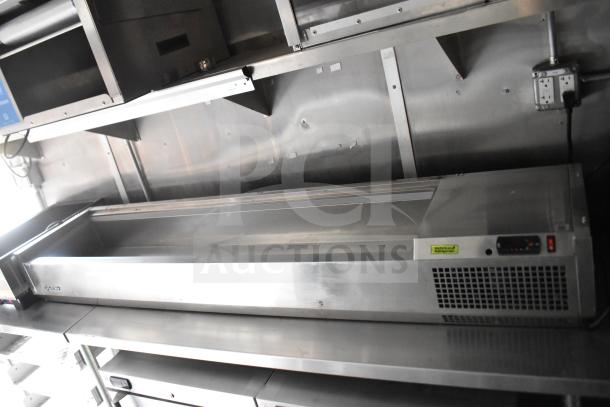 2021 Rock Solid Cargo 28ft food trailer interior, showcasing stainless steel refrigeration unit. Includes electric outlets, clean condition.