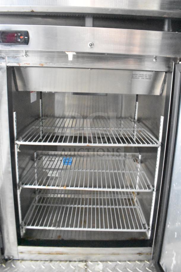 Stainless steel refrigeration shelving inside 2021 Rock Solid Cargo food trailer; VIN: 7H2BE283XND041759.