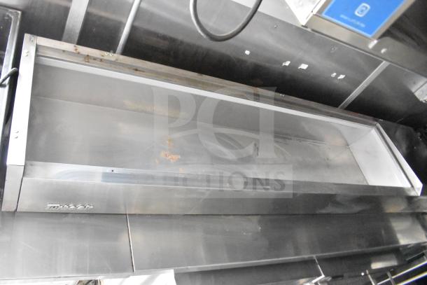 Interior of Rock Solid Cargo 28ft food trailer showing stainless steel commercial hood, with some visible wear.