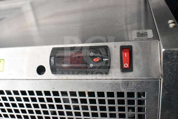 Control panel of a refrigeration unit in the 2021 Rock Solid Cargo 28ft food trailer, featuring on-off switch and digital display.