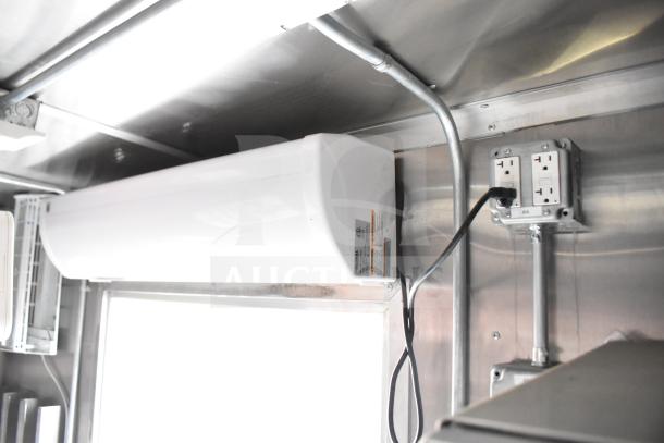 Interior of 2021 Rock Solid Cargo 28ft food trailer with electrical outlets and interior wiring visible.