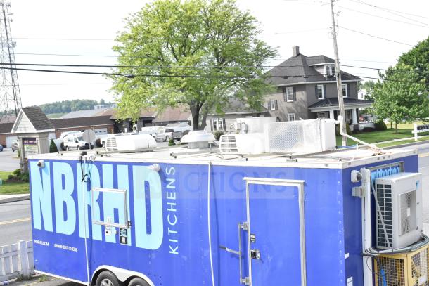 NBRHD Kitchens food trailer with dual Pitco gas fryers, CaptiveAire hood, Arctic Air refrigeration, Daikin mini-split system.
